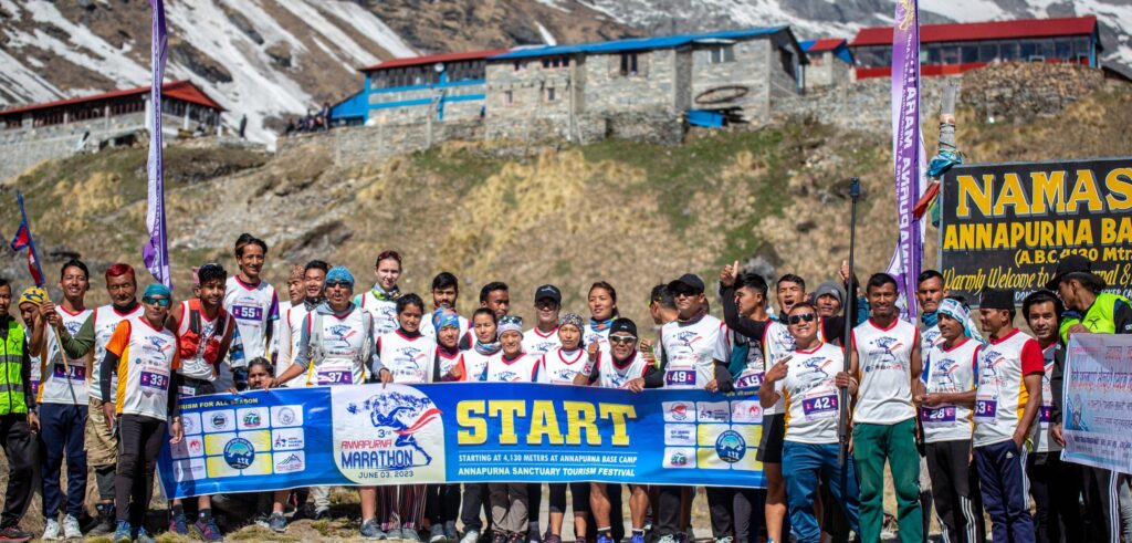 Runners participating in Annapurna Marathon, starting from Annapurna Base Camp for Ghandruk through scenic mountain trails.