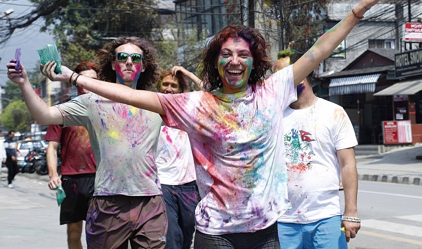 foreigner enjoying holi color festival event in Pokhara Nepal