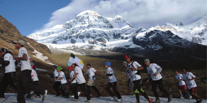 Runners participating in Annapurna Marathon, descending from Annapurna Base Camp to Ghandruk through scenic mountain trails